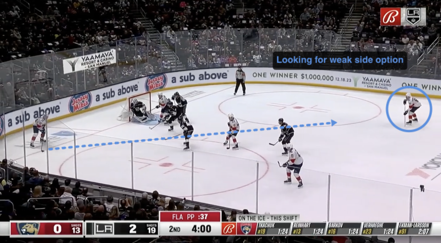 Paused game frame with a coach's arrow and circle drawn on the play